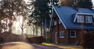 A home at dusk seen from the street.