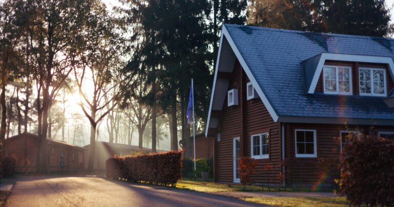 A home at dusk seen from the street.