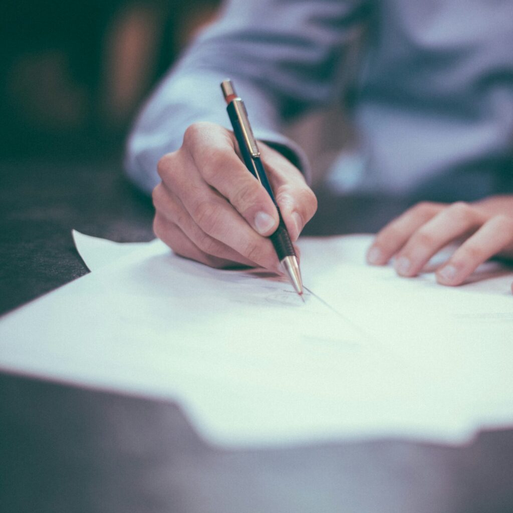 A man writes out a last will and testament.
