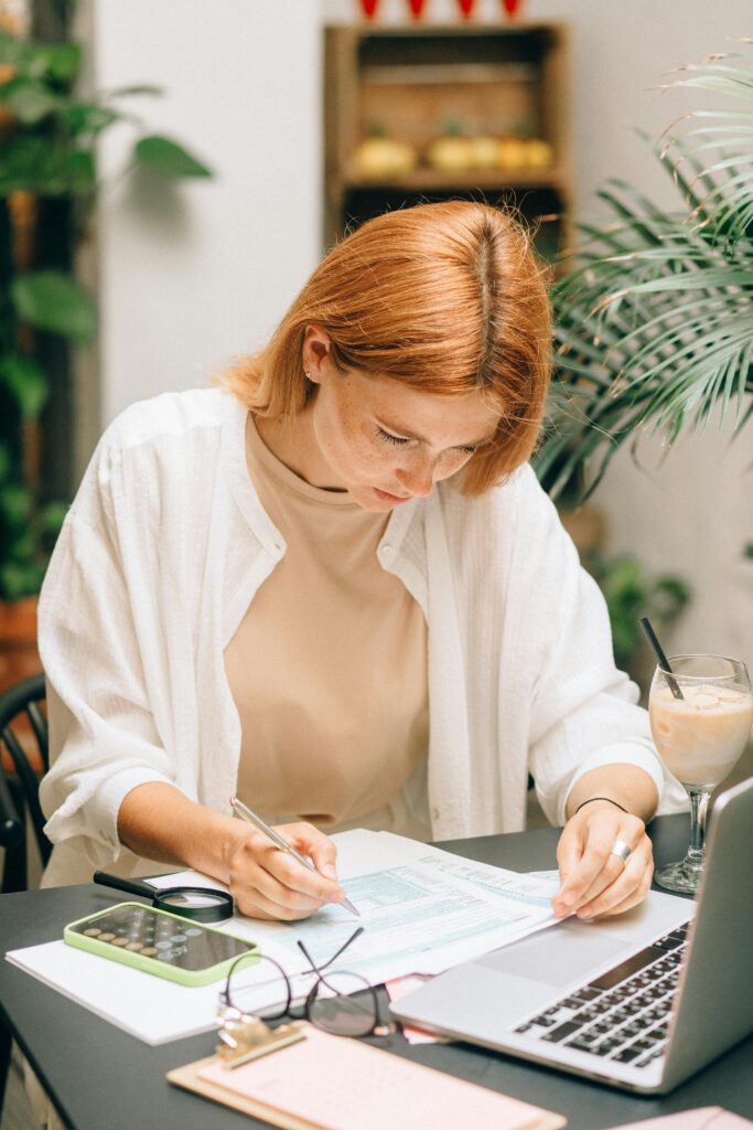 A woman tries to get through confusing paperwork.