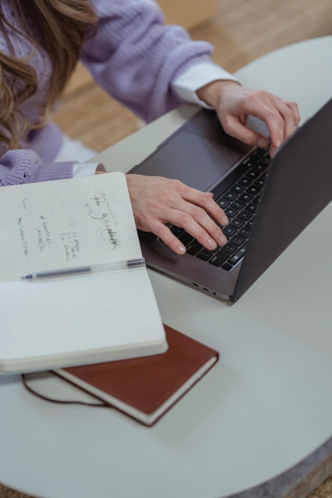 A woman searches for unclaimed property on her laptop.