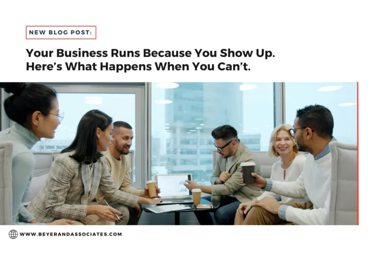 Group of six diverse professionals engaged in a meeting with laptops and coffee in a modern office.